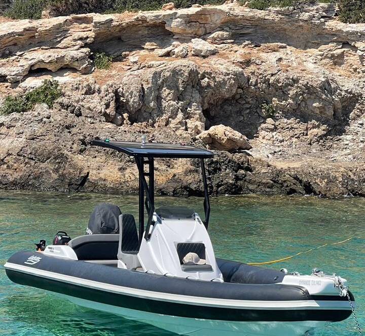 The 7-meter Luxury RIB, a vessel for luxurious exploration, cutting through the Aegean towards undiscovered wonders.